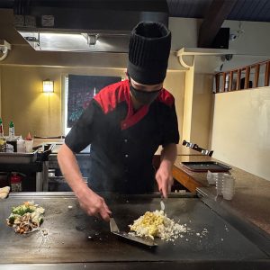 Chef preparing fried rice at Fuji Teppanyaki & Sushi restaurant in Lynnwood, WA.