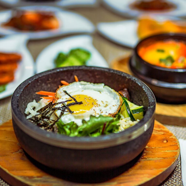 a group of bowls of food on a table.